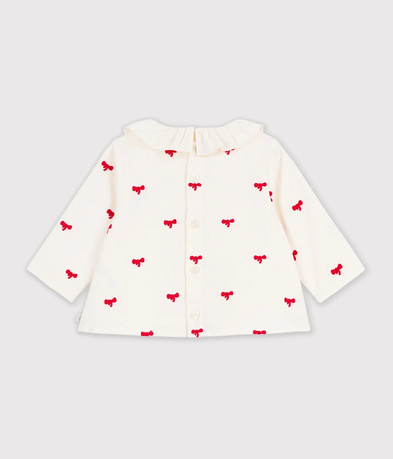 Babies' blouse in velour embroidered with a bow motif