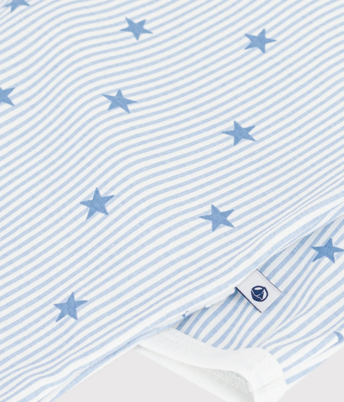 Babies' star-print fleece pyjama suit with a back opening