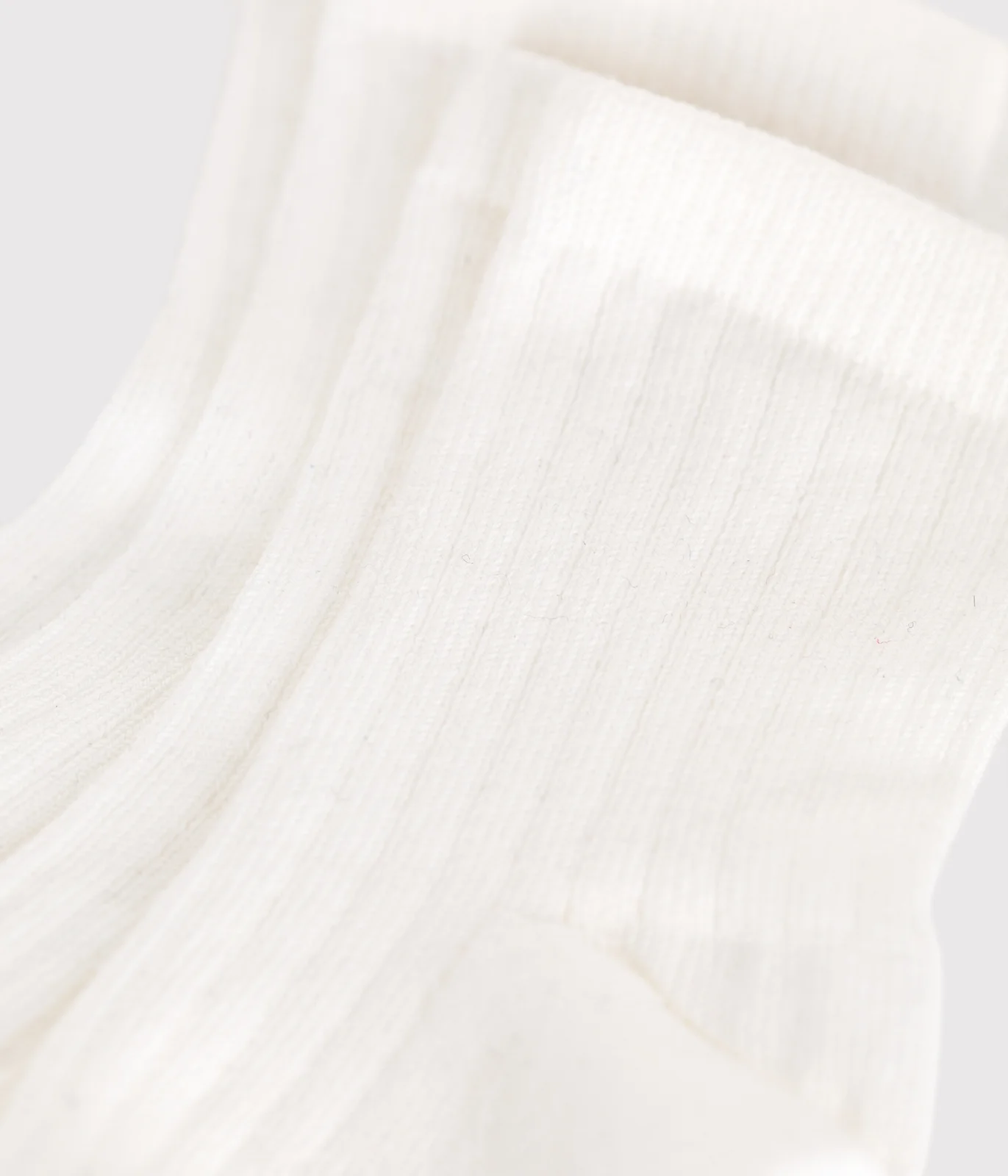 Pack of solid-color cotton baby socks with ribbed cuffs