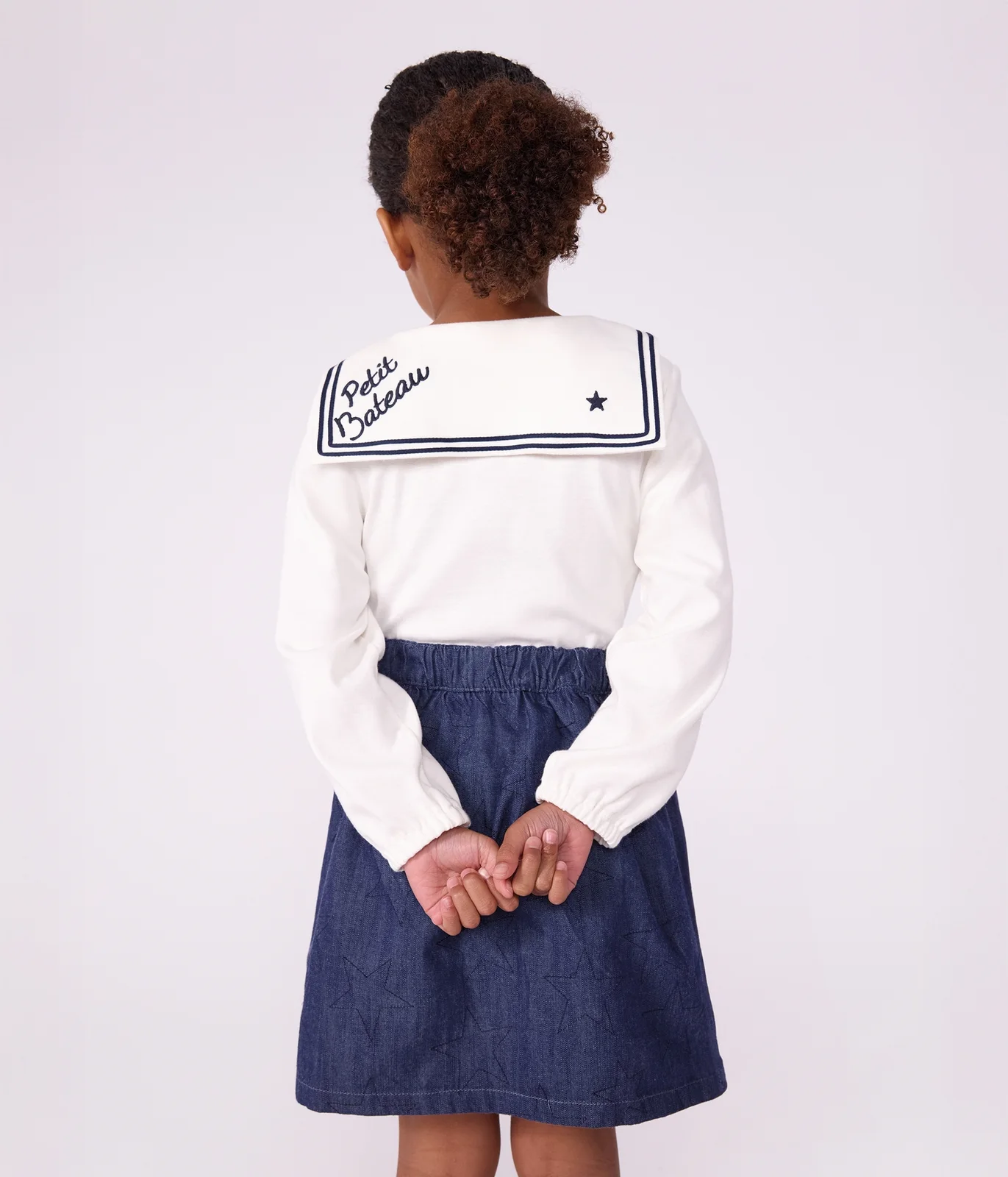 Short skirt in plain denim with a star pattern