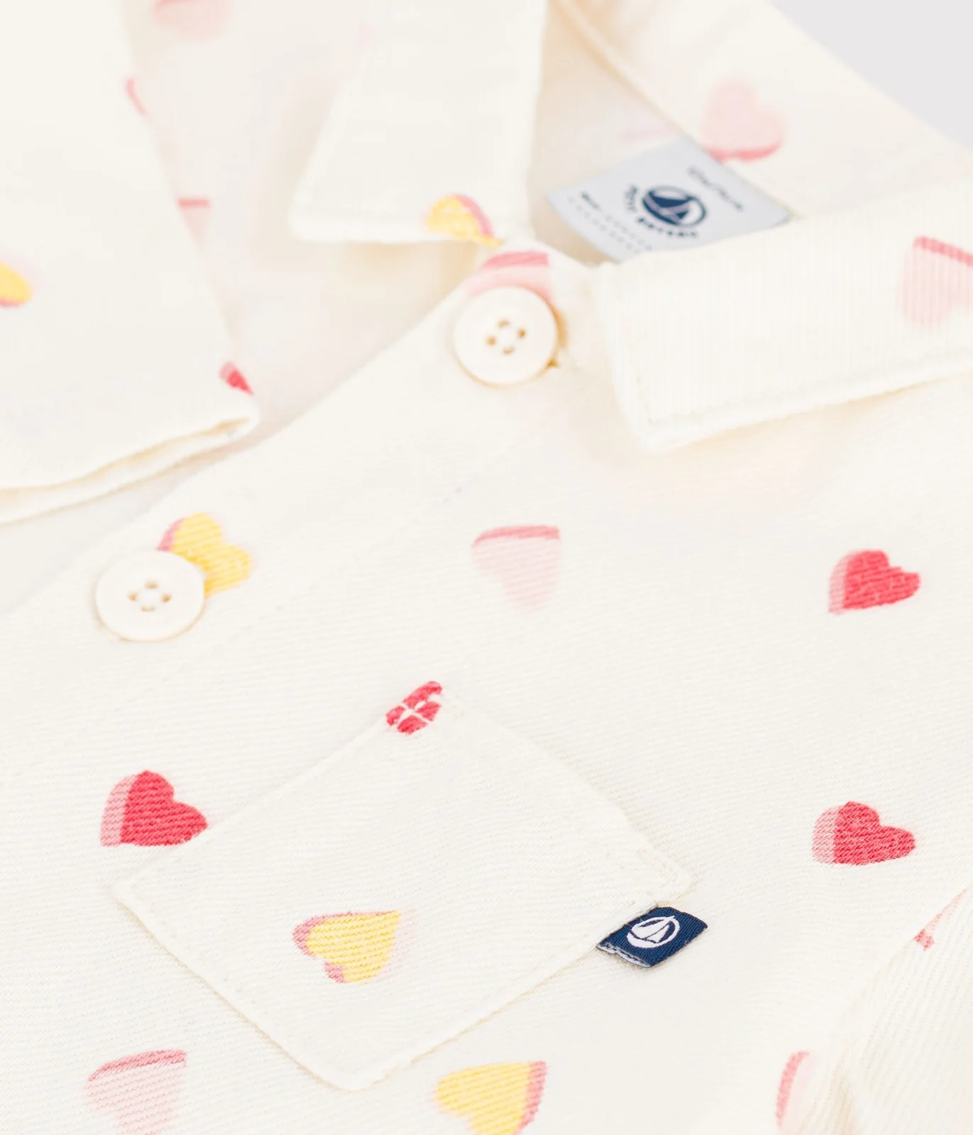 Babies' long jumpsuit in cotton with a heart print