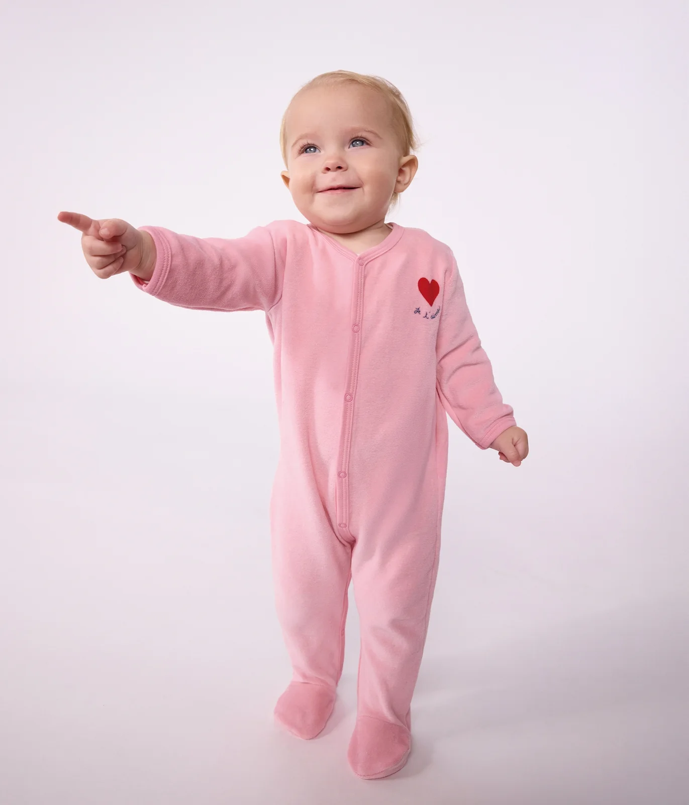 Babies' plain velour pyjama suit with a placed design