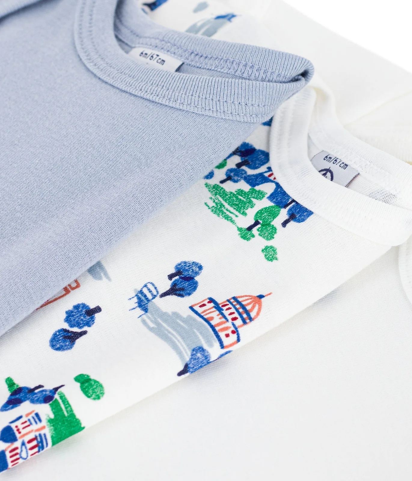 Pack of short-sleeved star print cotton bodies for babies