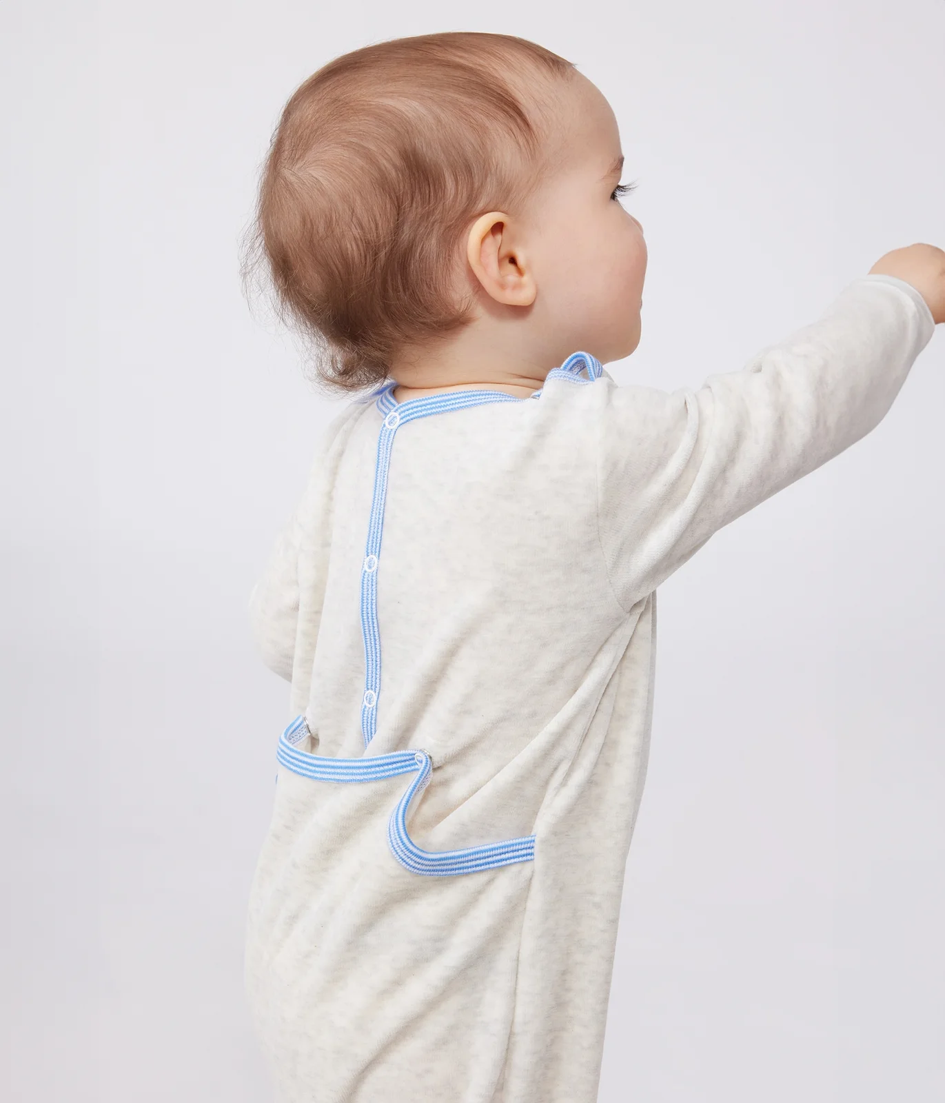 Babies' velour pyjama suit with a back opening