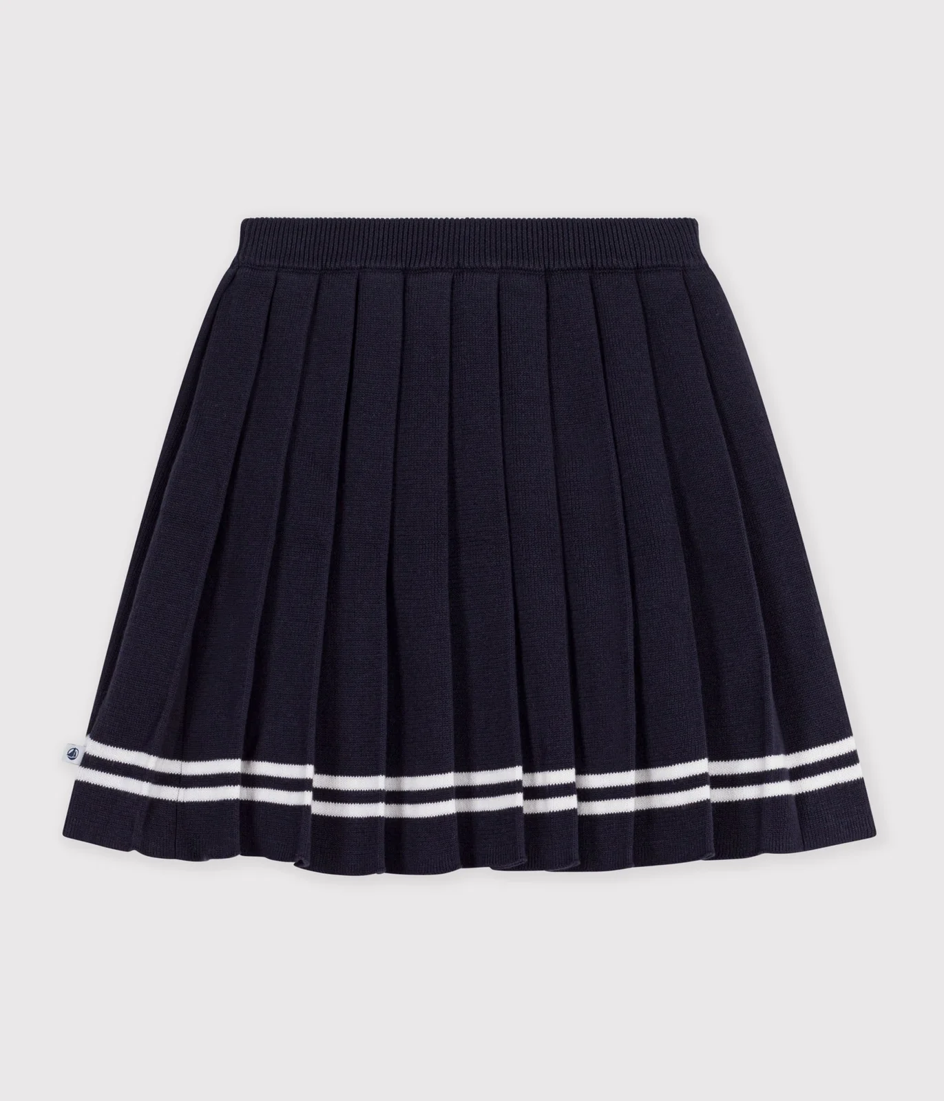 Children's short pleated skirt in plain cotton knit