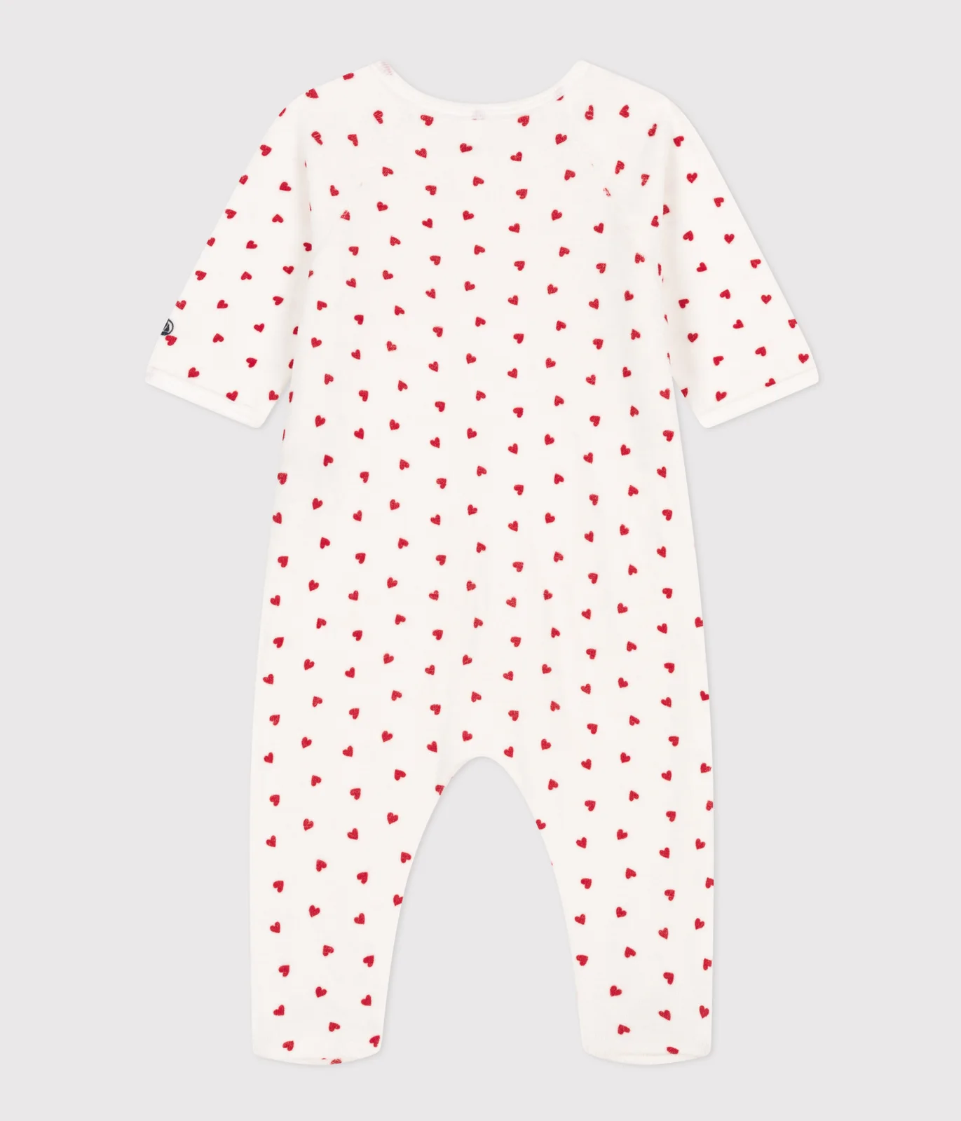 Unisex baby sleepsuit in Velour with a small heart print