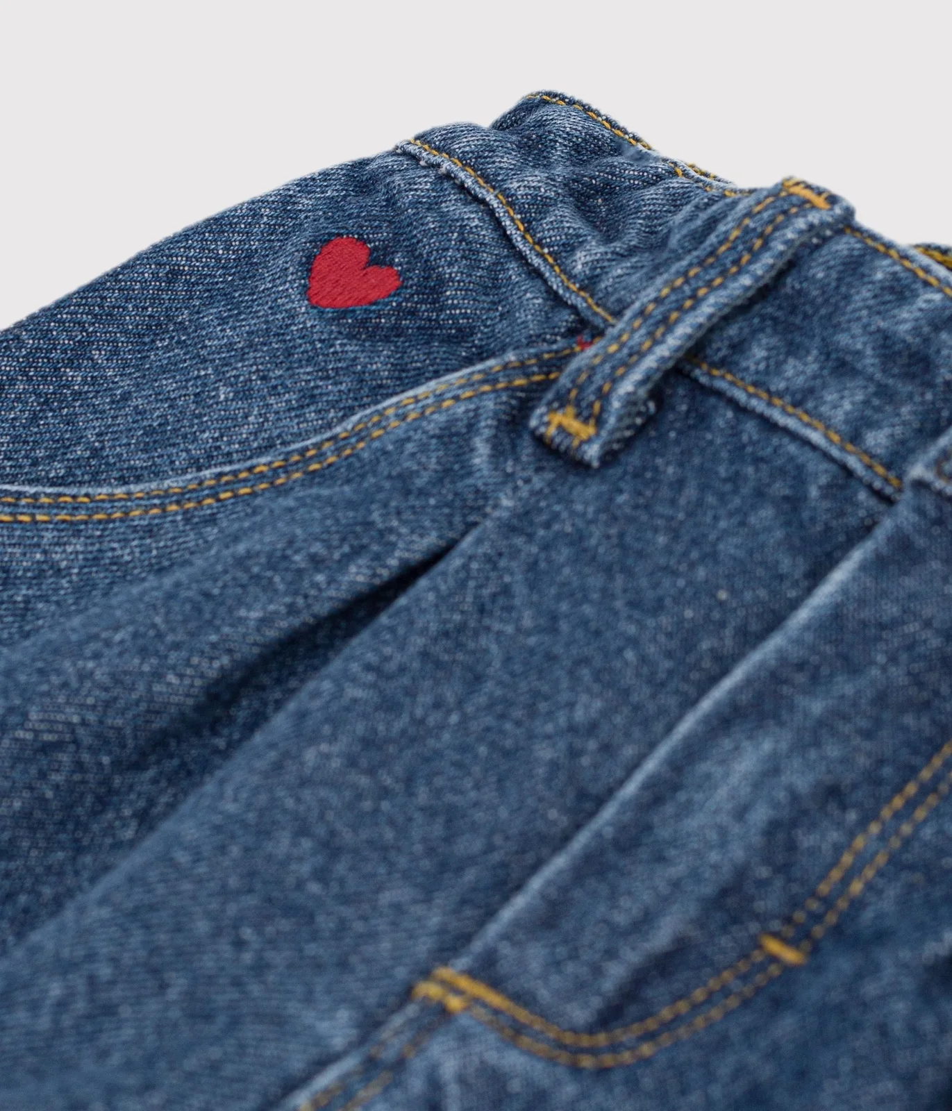Babies' trousers in plain denim with heart embroidery