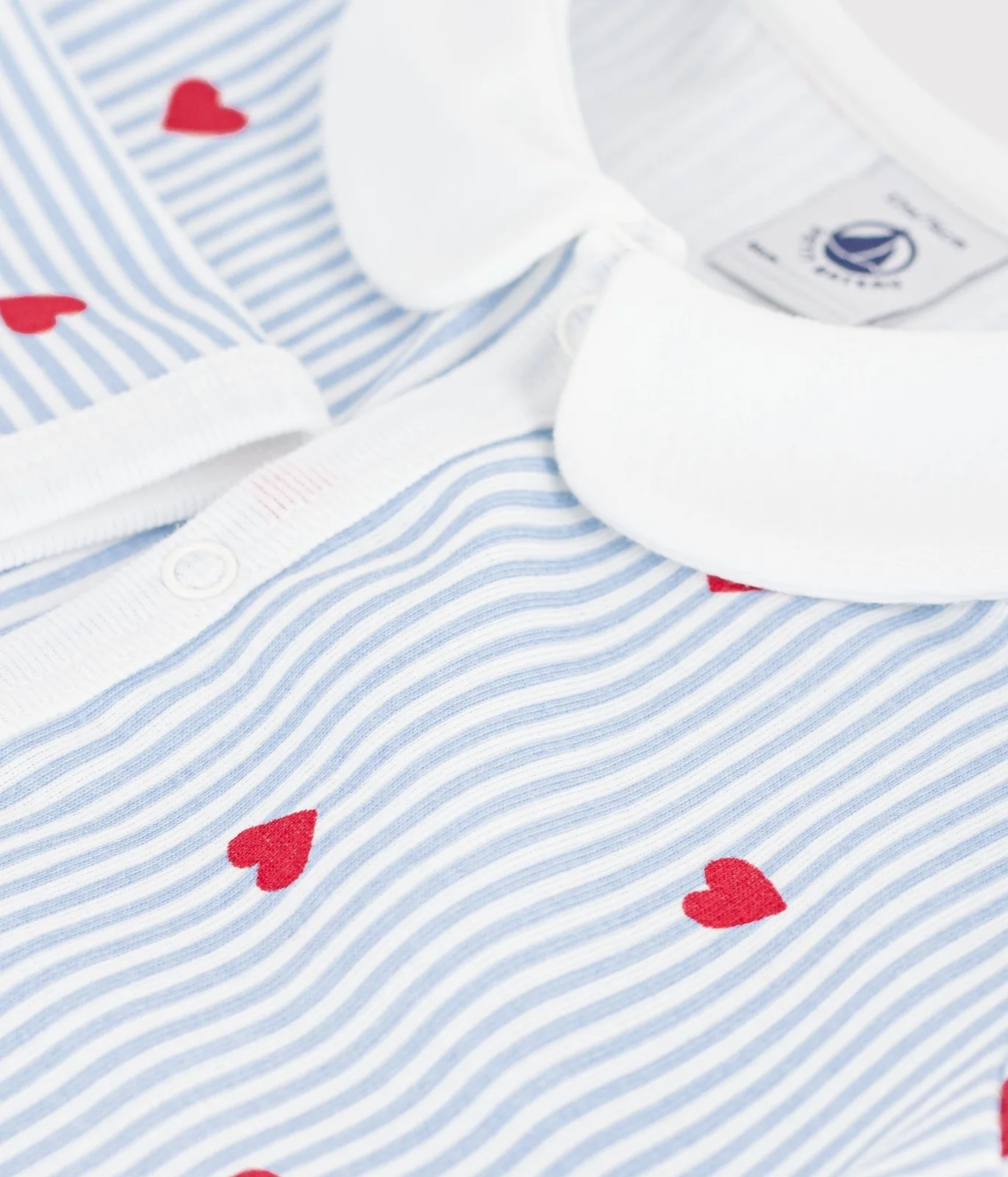Baby footless cotton pyjamas with heart print
