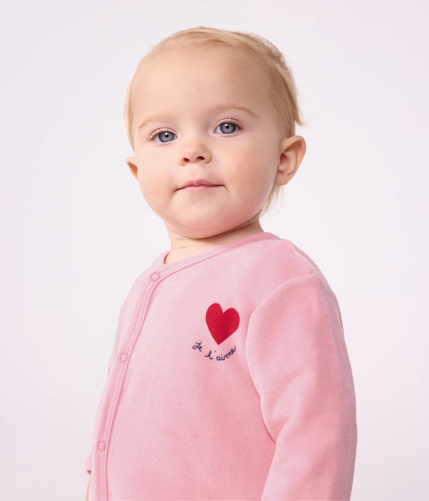 Babies' plain velour pyjama suit with a placed design