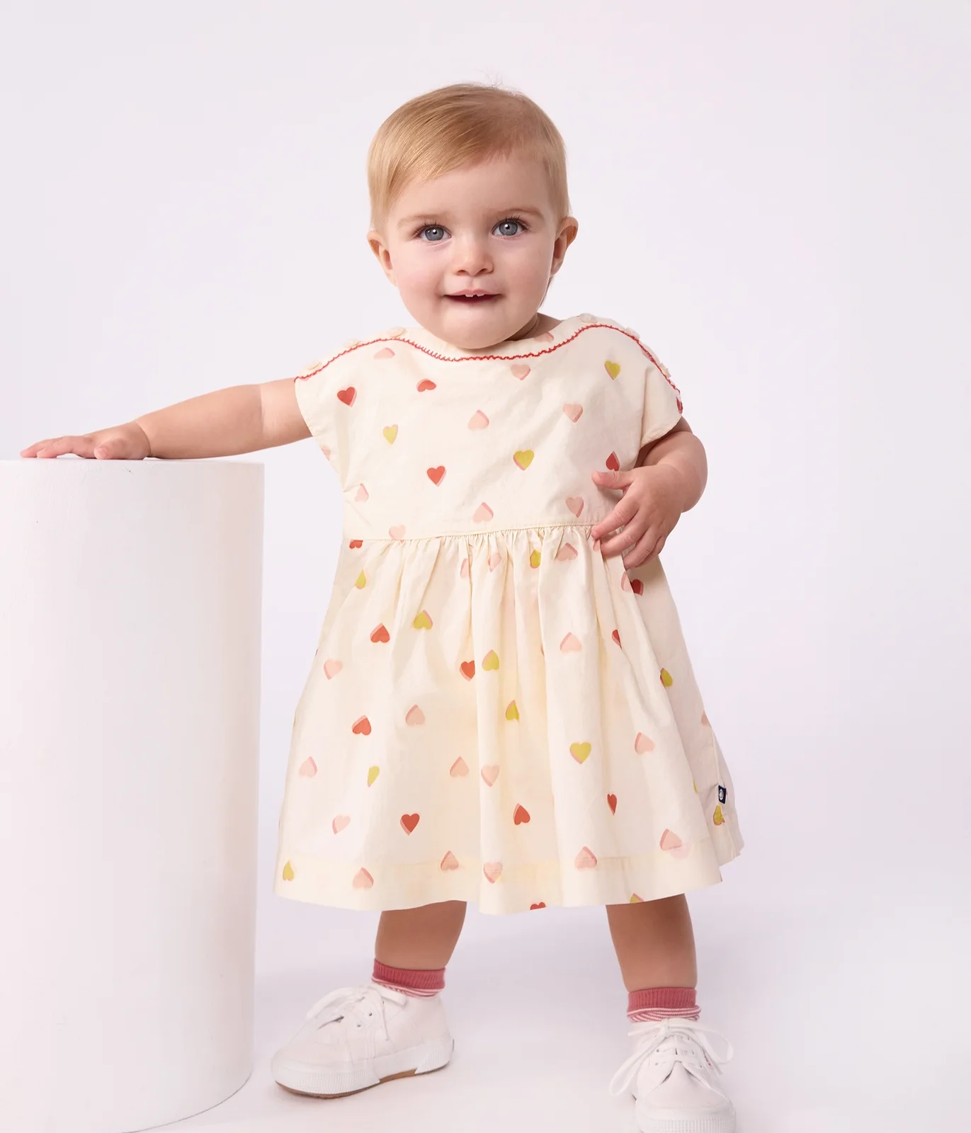 Babies' short-sleeved cotton dress printed with hearts.