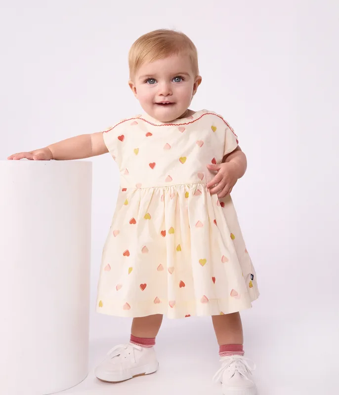 Babies' short-sleeved cotton dress printed with hearts.