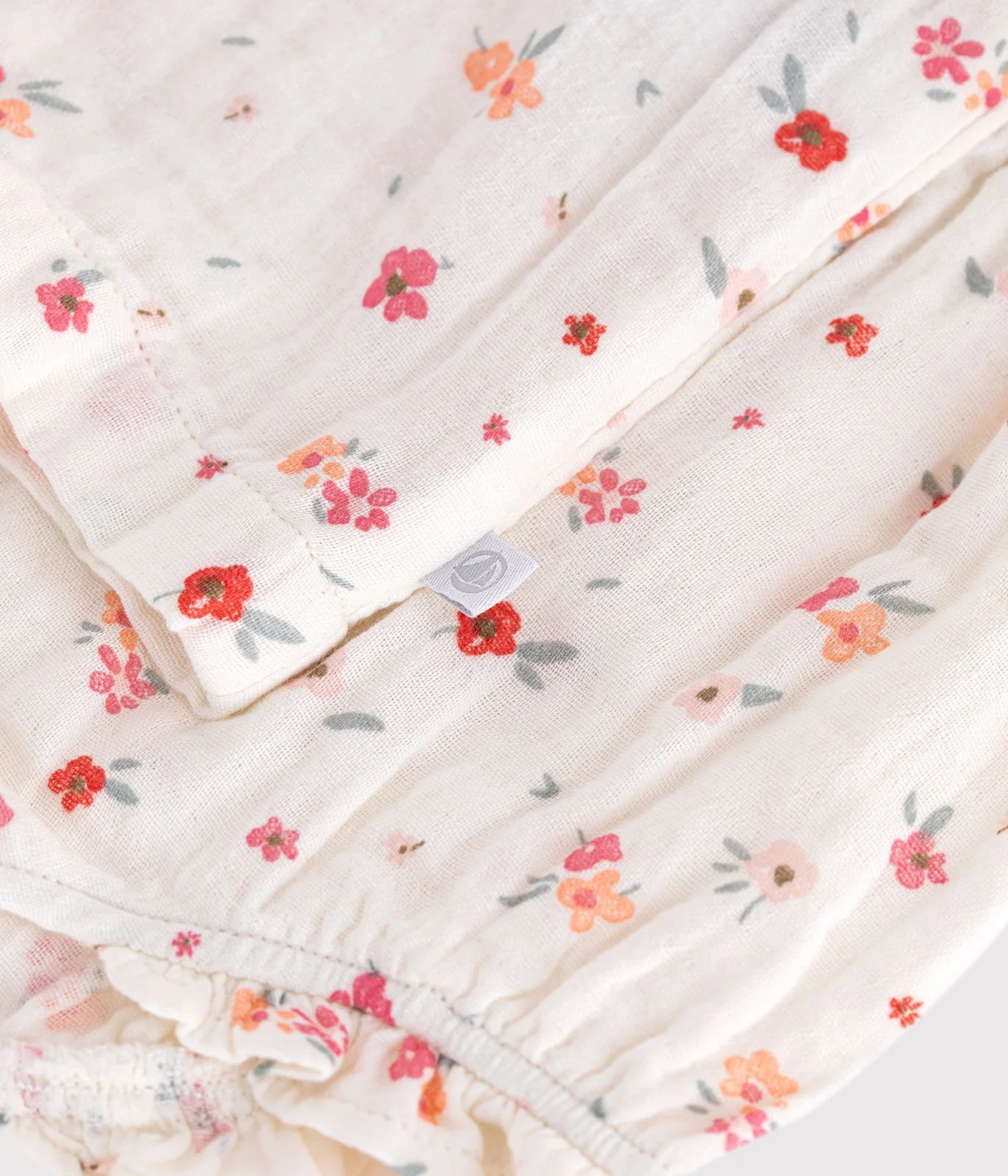 Sleeveless baby dress in printed cotton