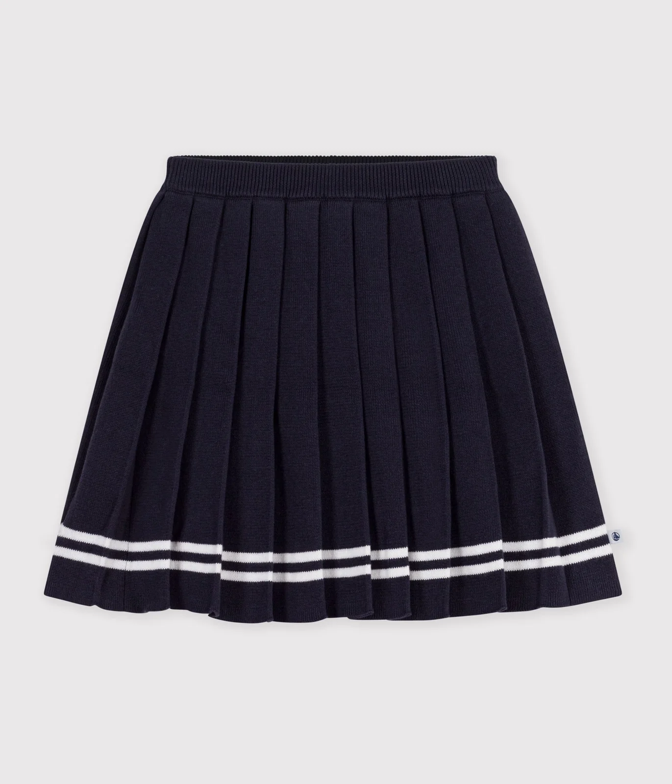 Children's short pleated skirt in plain cotton knit