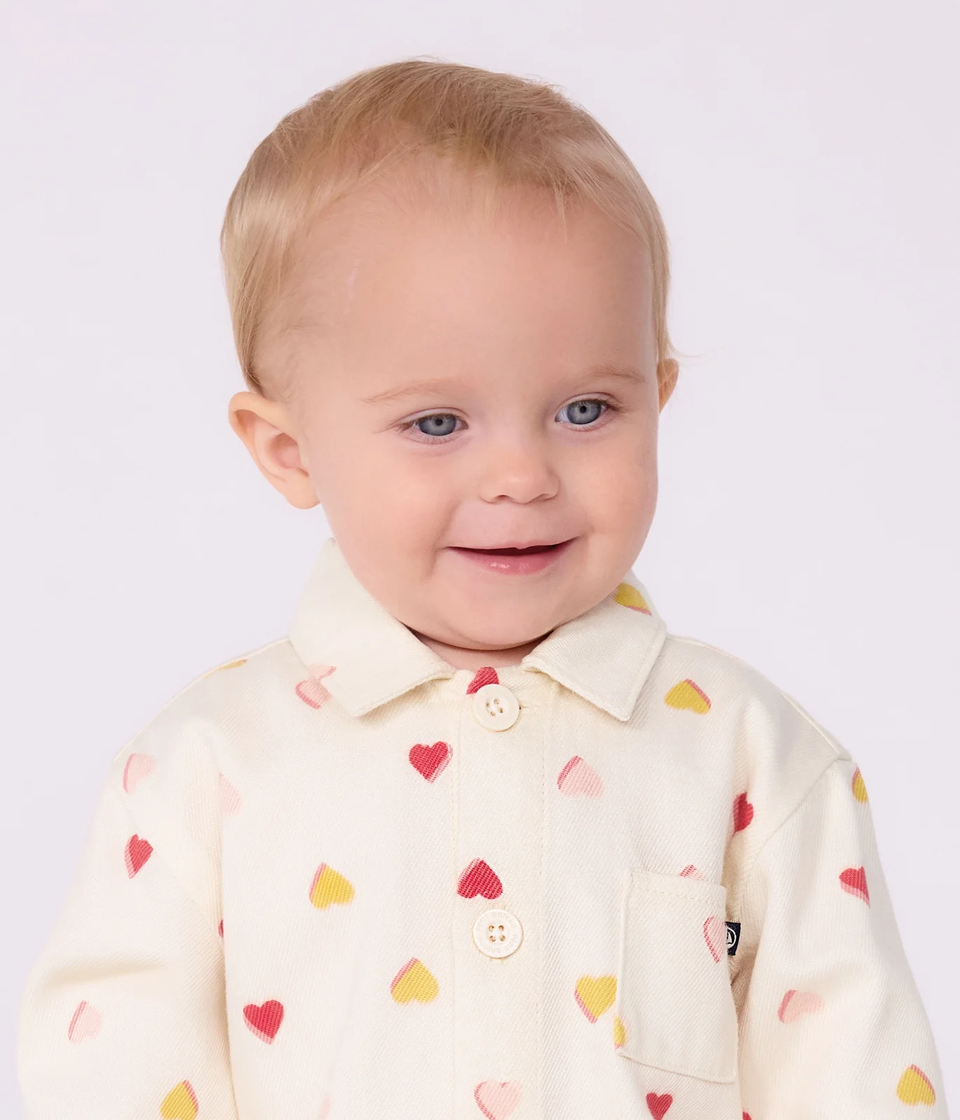 Babies' long jumpsuit in cotton with a heart print