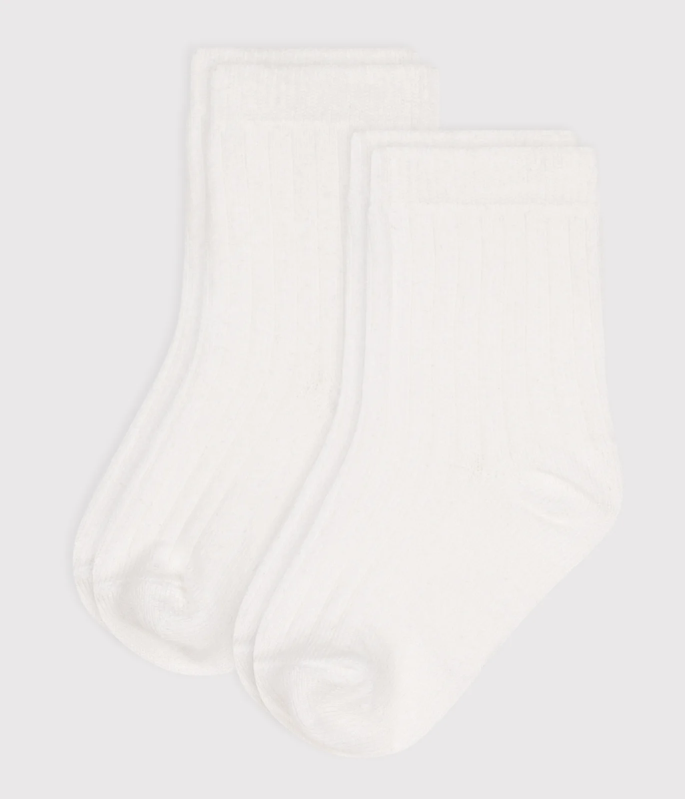 Pack of solid-color cotton baby socks with ribbed cuffs
