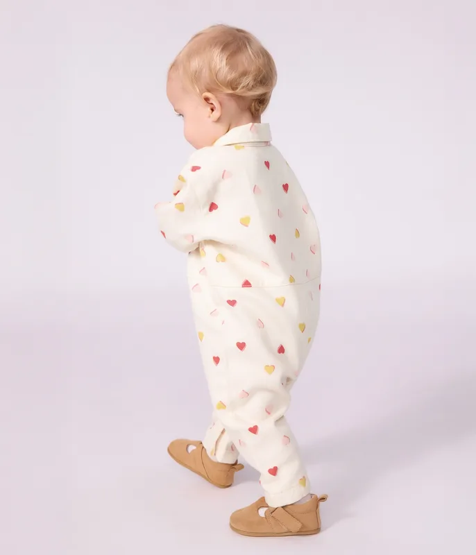 Babies' long jumpsuit in cotton with a heart print