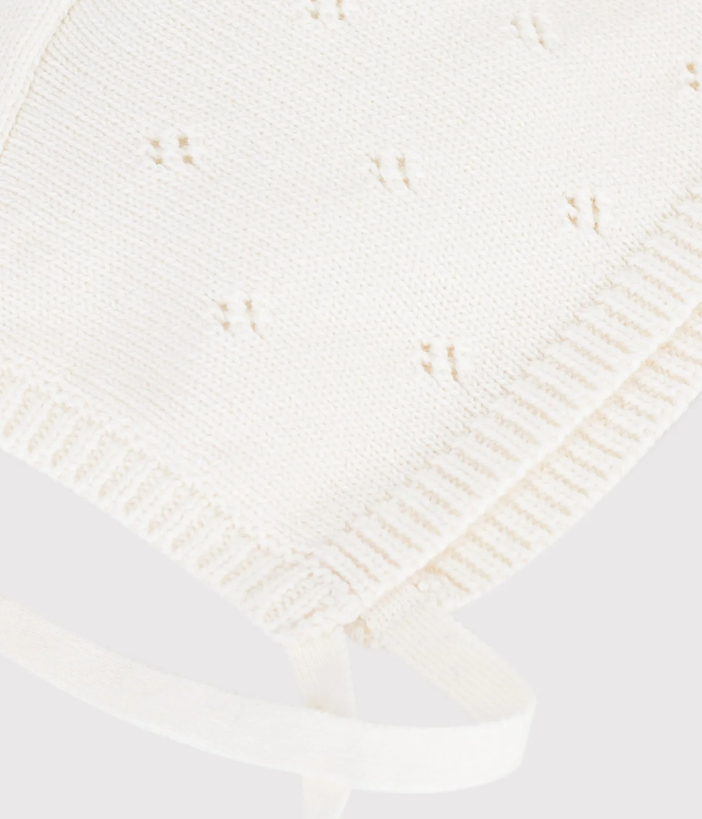Baby hat in openwork knit