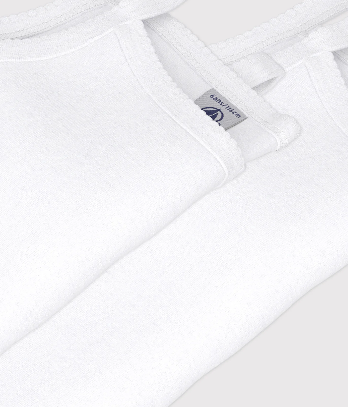 Pack of solid cotton camisoles for children