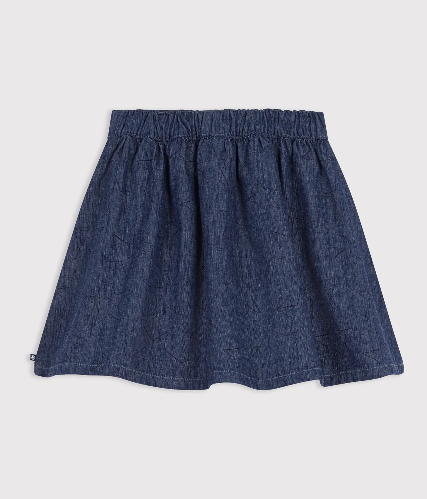 Short skirt in plain denim with a star pattern