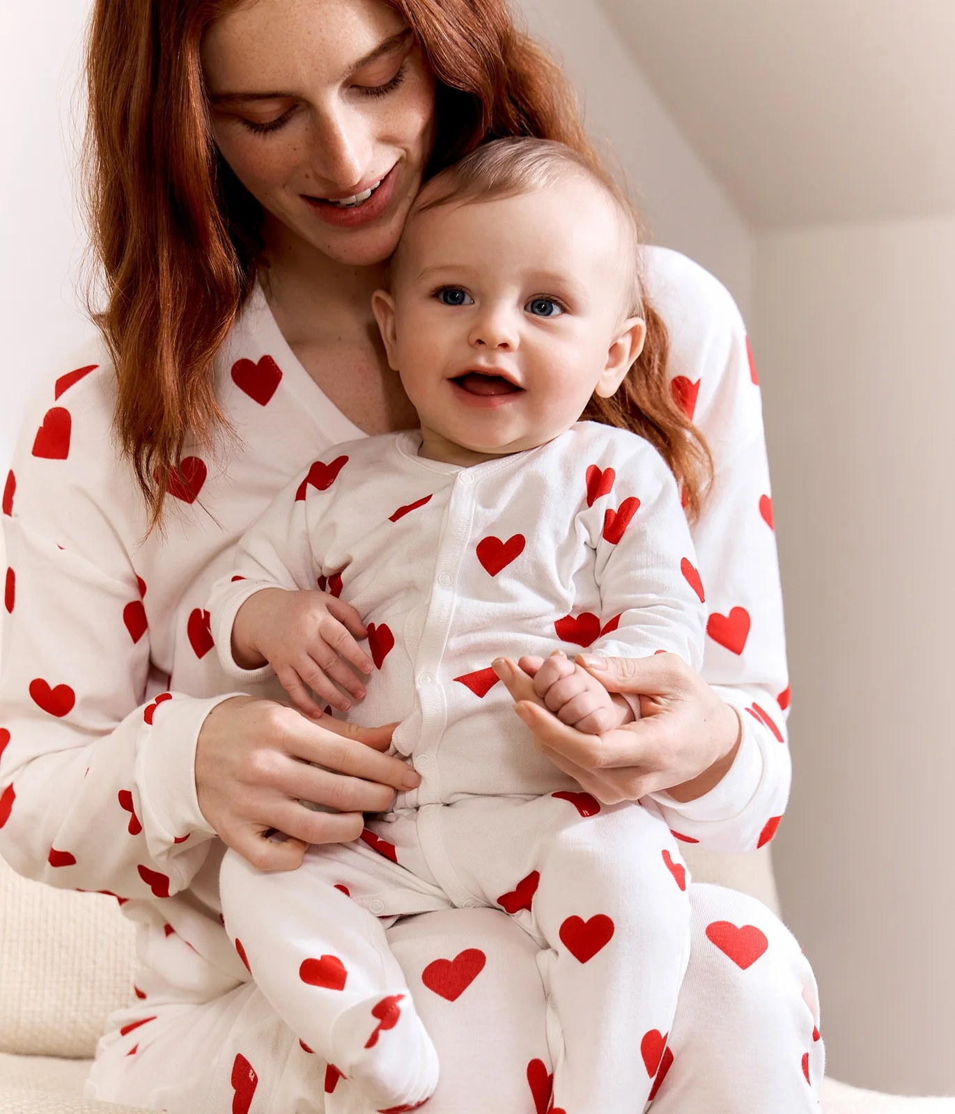 Baby fleece pyjamas with red hearts