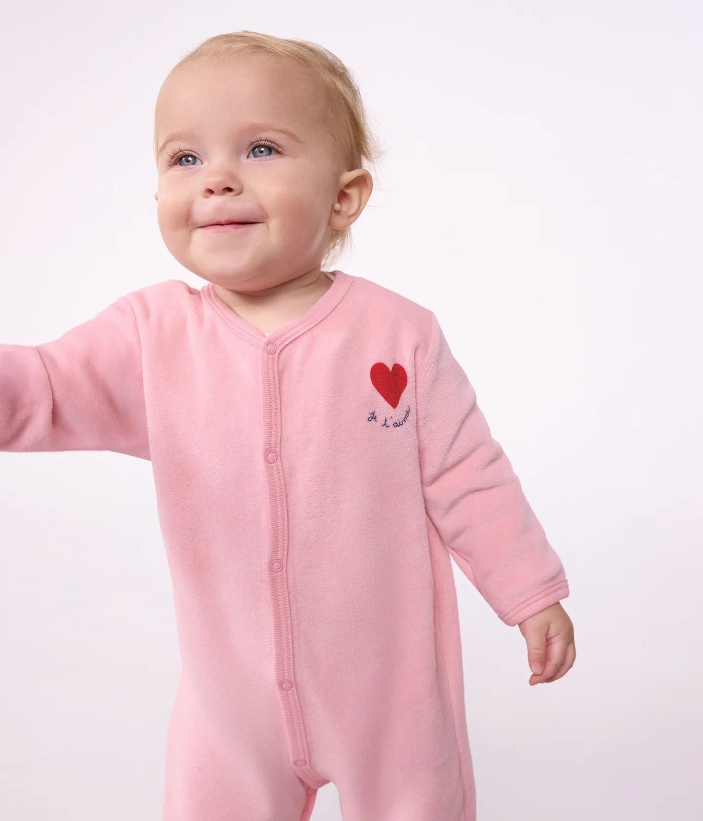 Babies' plain velour pyjama suit with a placed design