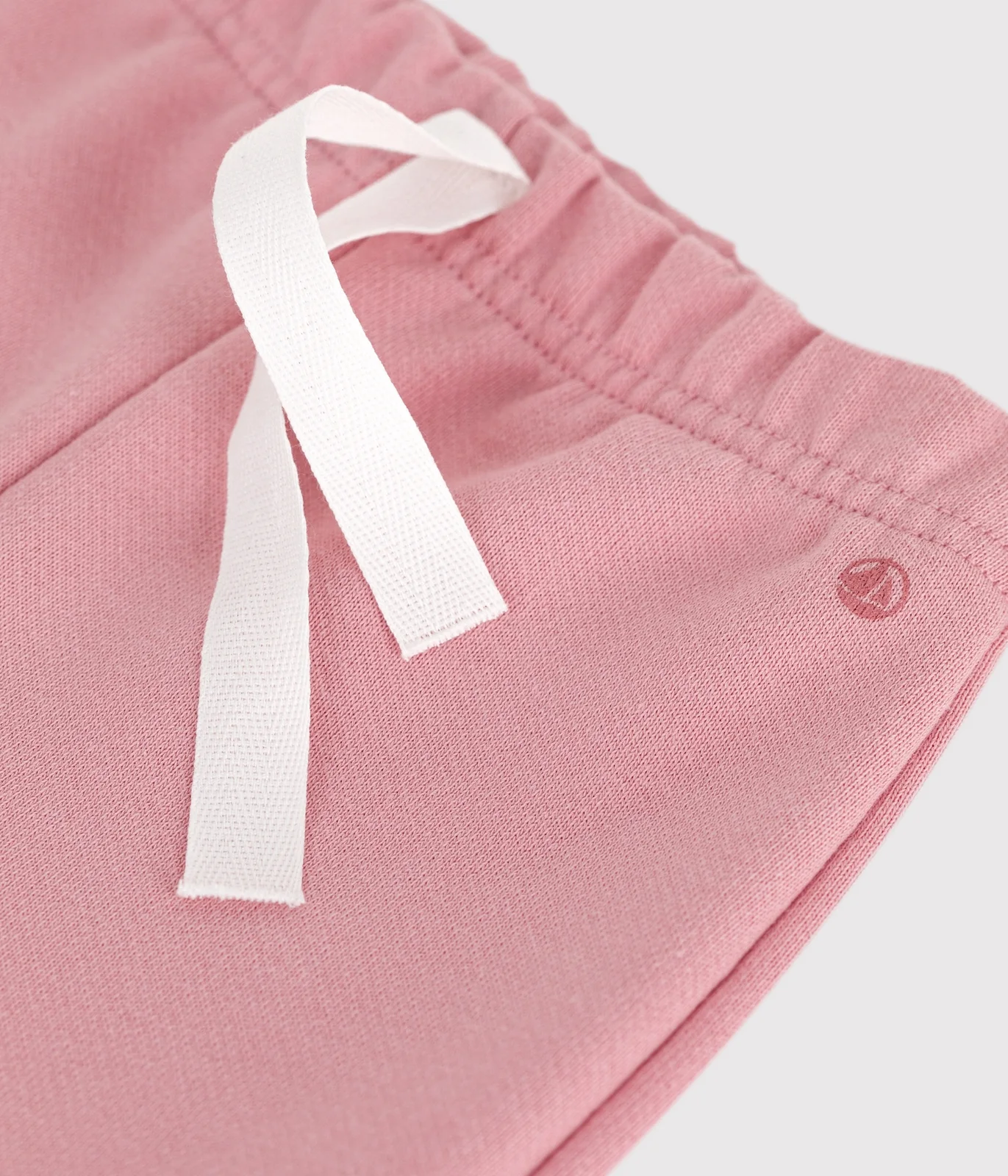 Babies' jogging bottoms in plain cotton