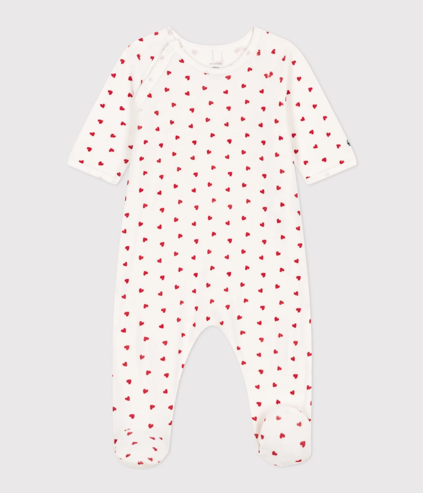 Unisex baby sleepsuit in Velour with a small heart print