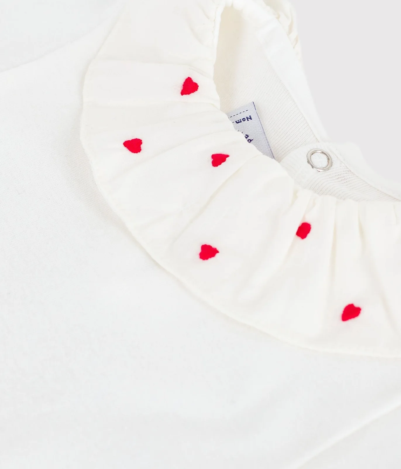 Babies' plain cotton body with an embroidered collar