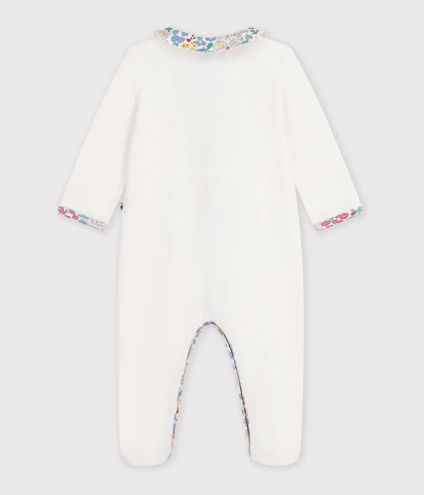 Babies' pyjama suit in plain velour with a collar and floral print detail