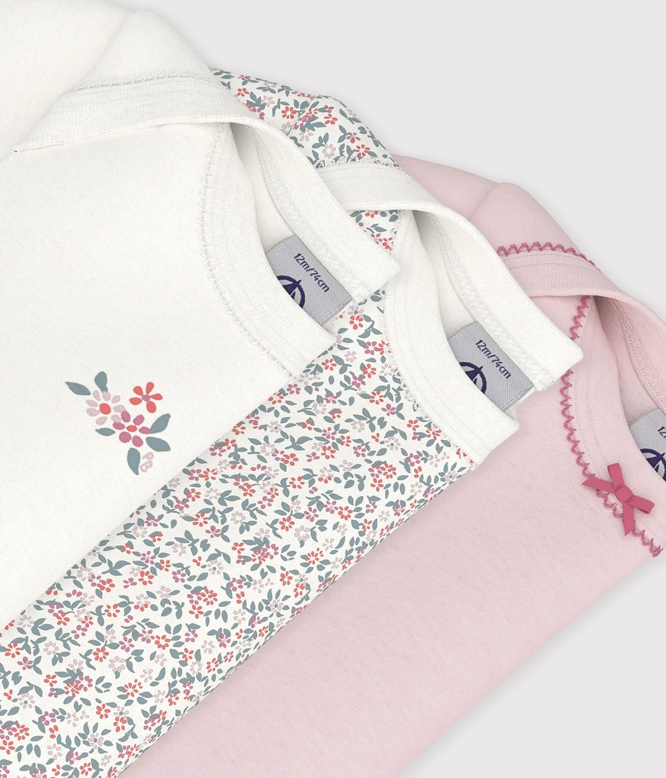 Pack of short-sleeved flower print cotton bodies for babies