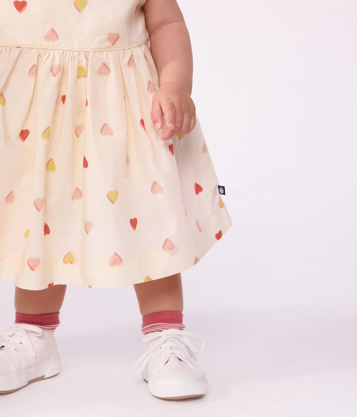 Babies' short-sleeved cotton dress printed with hearts.