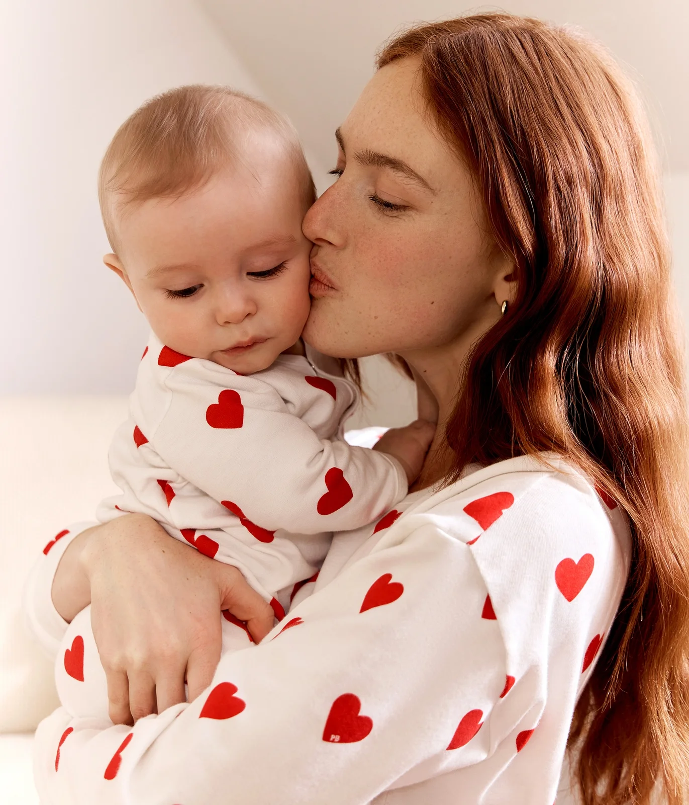Baby fleece pyjamas with red hearts
