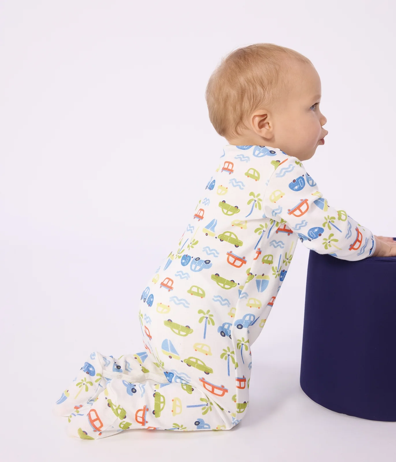 Babies' cotton pyjama suit with a motor car print