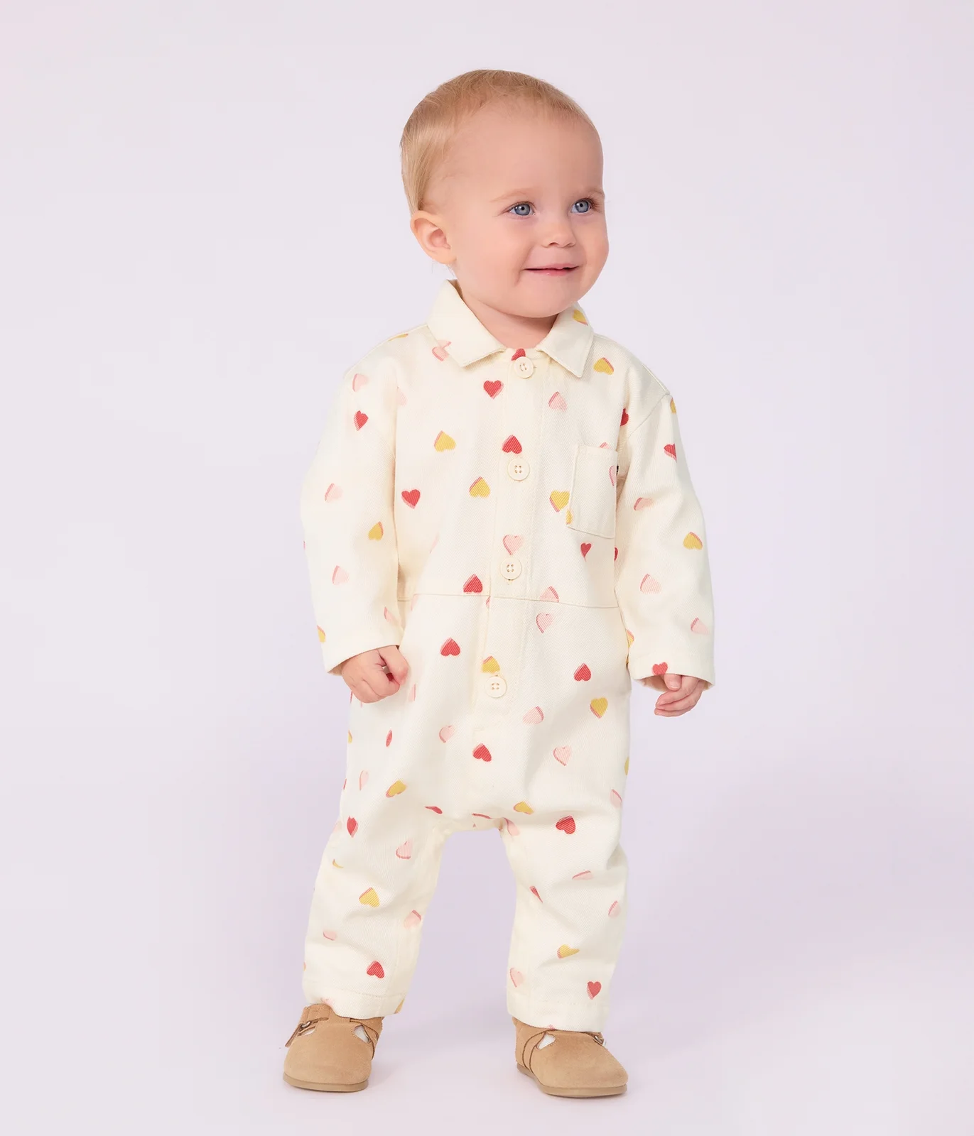 Babies' long jumpsuit in cotton with a heart print