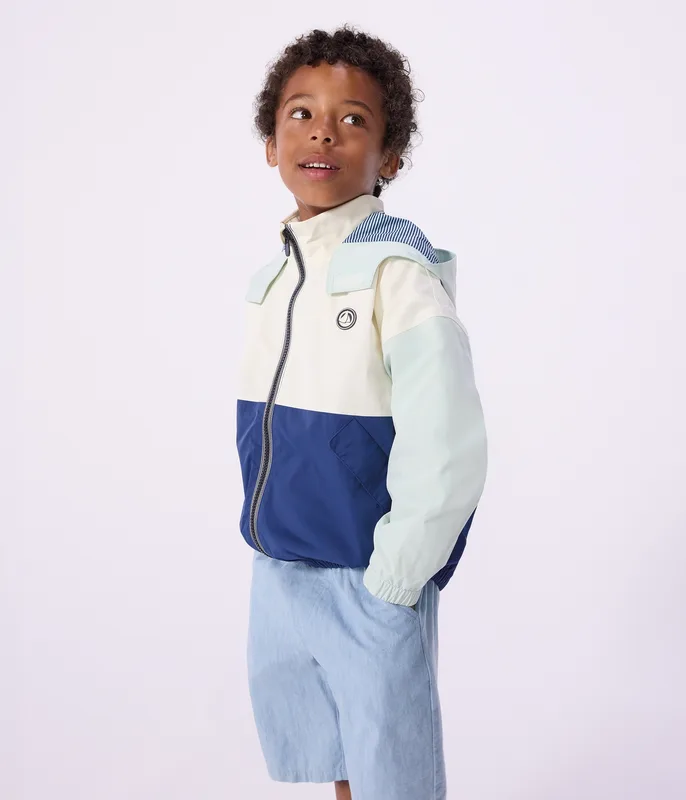 Children's windbreaker with a retractable hood