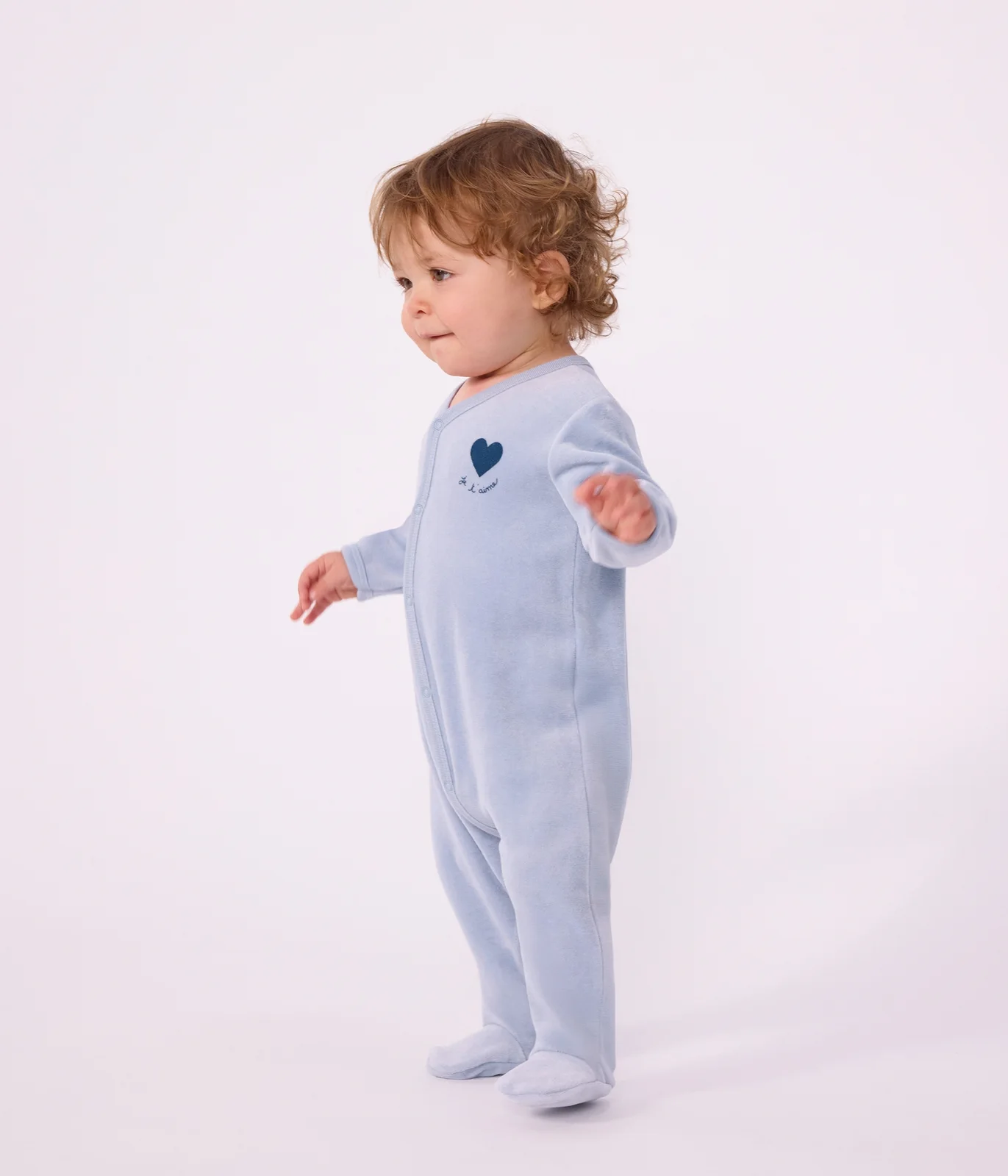 Babies' plain velour pyjama suit with a placed design