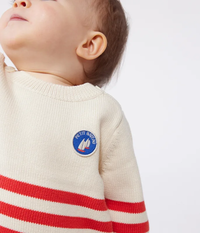 Babies' cotton jumper with placed stripes and a badge on the chest