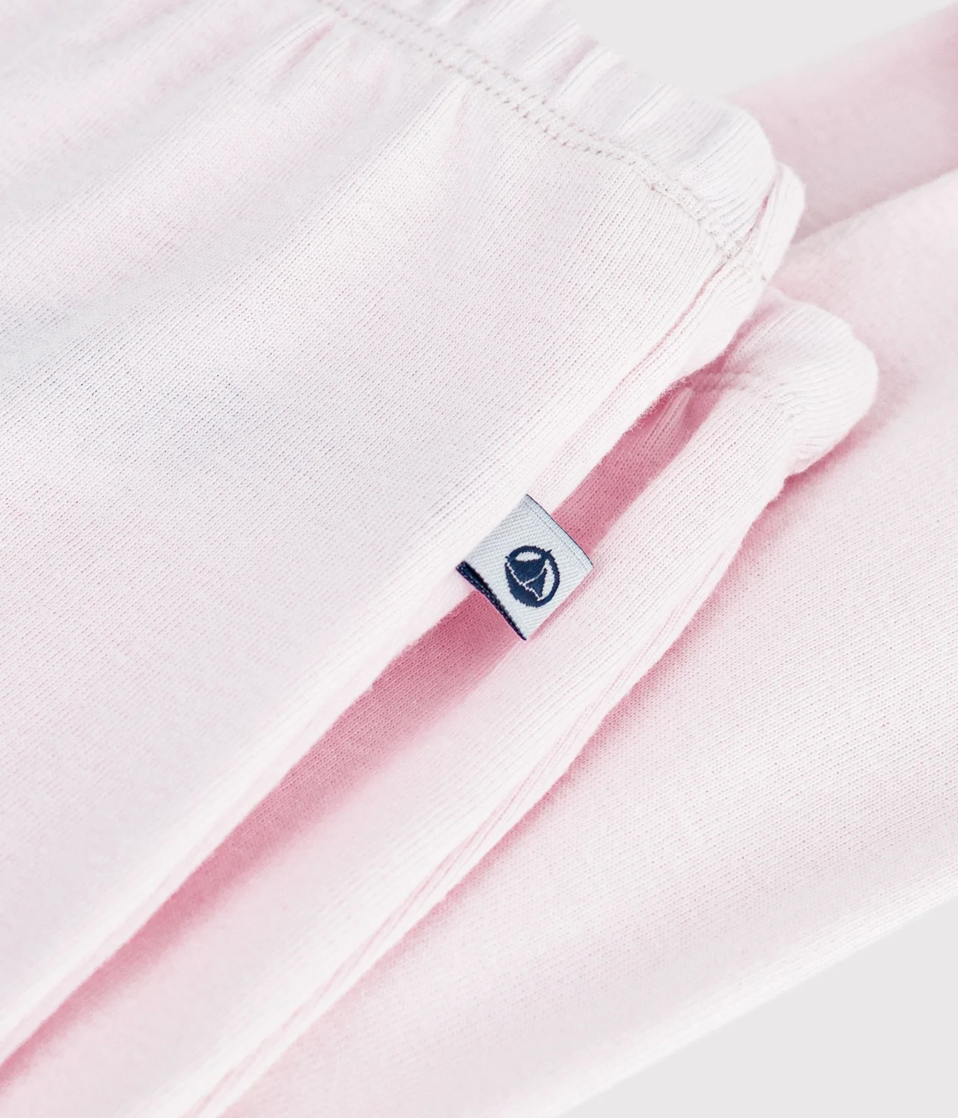 Footed newborn trousers in plain cotton