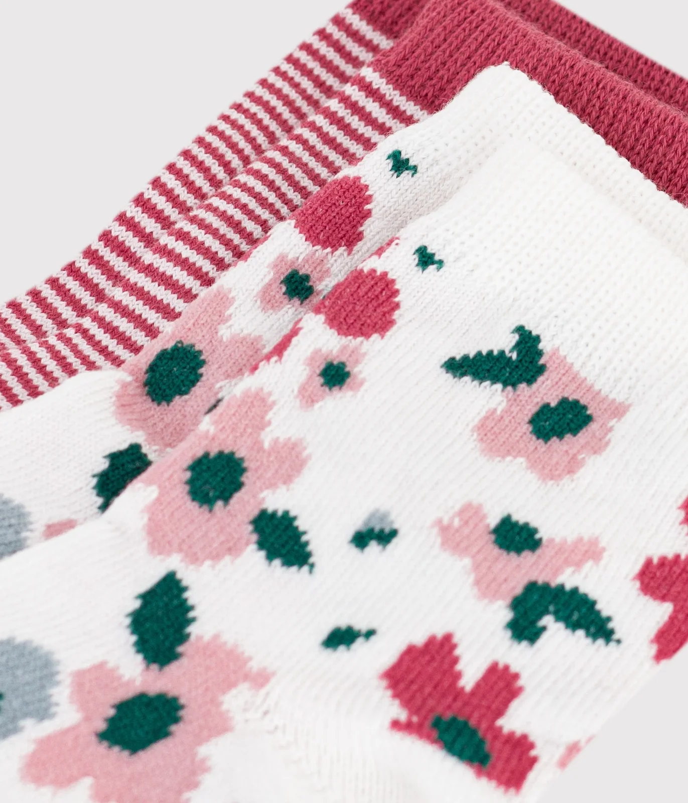 2 pairs of babies' cotton socks with stripes and a floral print