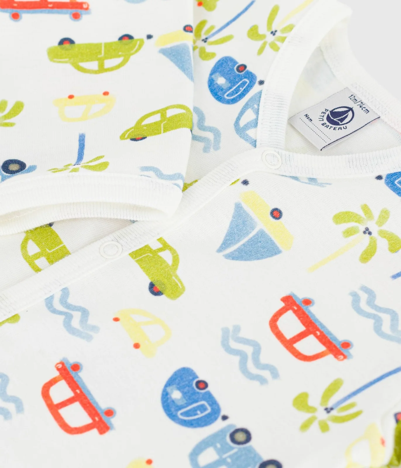 Babies' cotton pyjama suit with a motor car print