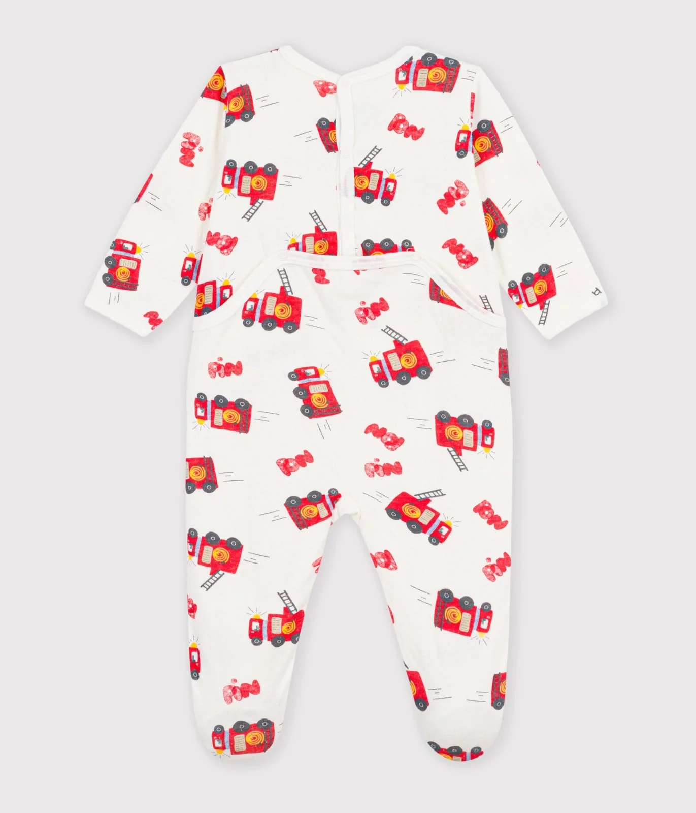 Babies' pyjama suit in tube knit fabric with a printed firefighter design and a back opening