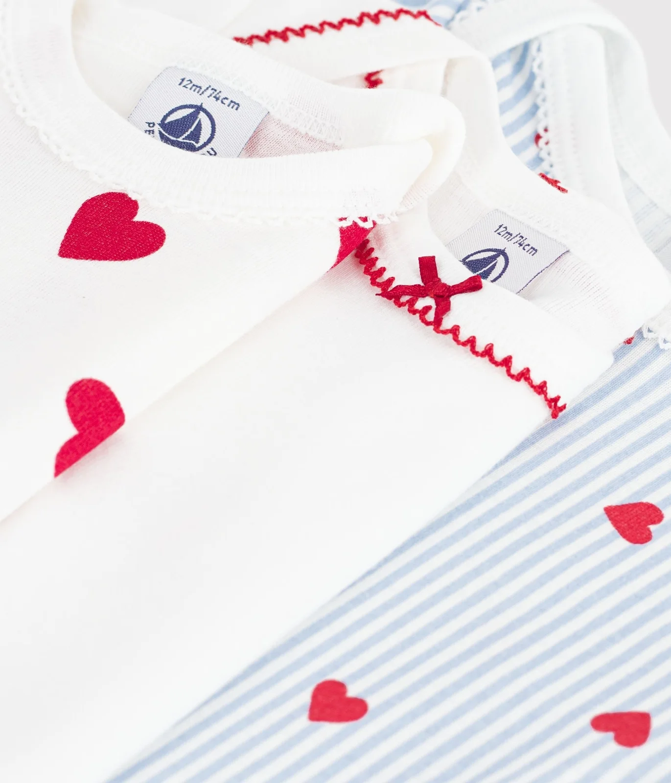 Pack of long-sleeved heart-print cotton bodies for babies