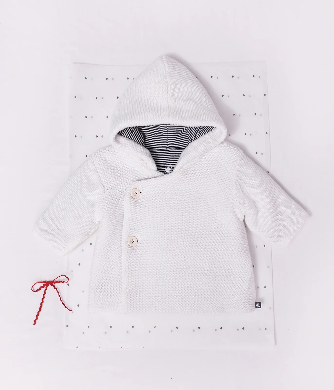 Babies' padded knitted jacket with a pinstripe lining