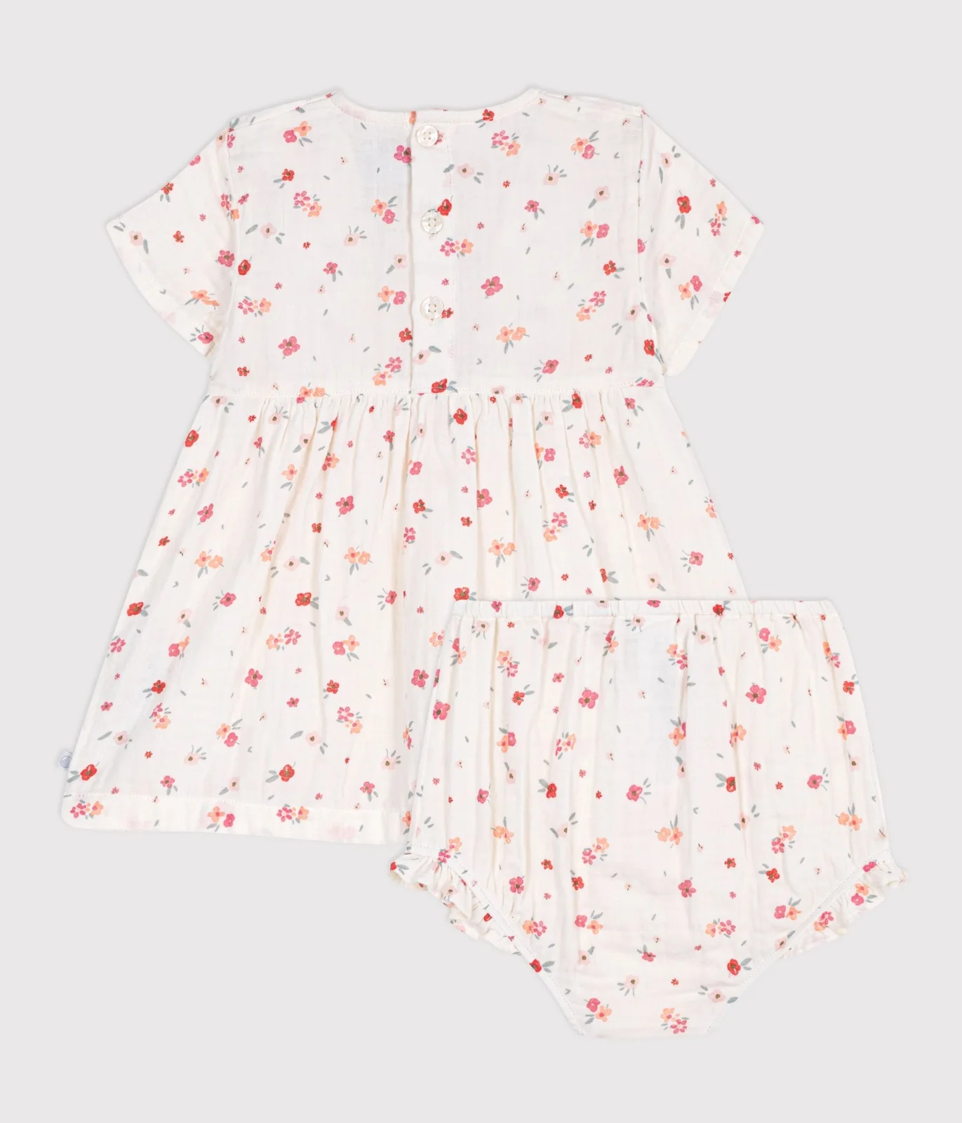 Sleeveless baby dress in printed cotton