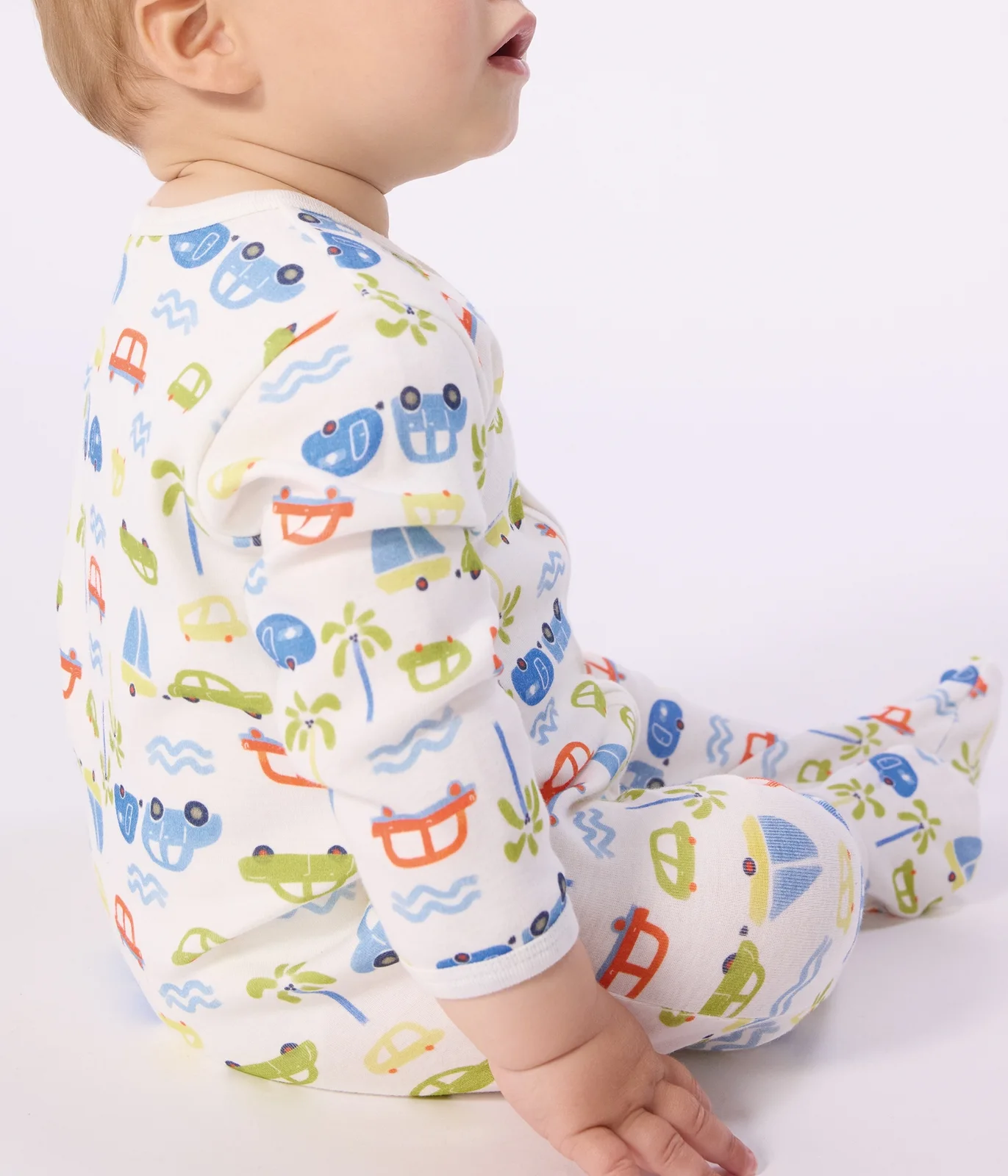 Babies' cotton pyjama suit with a motor car print
