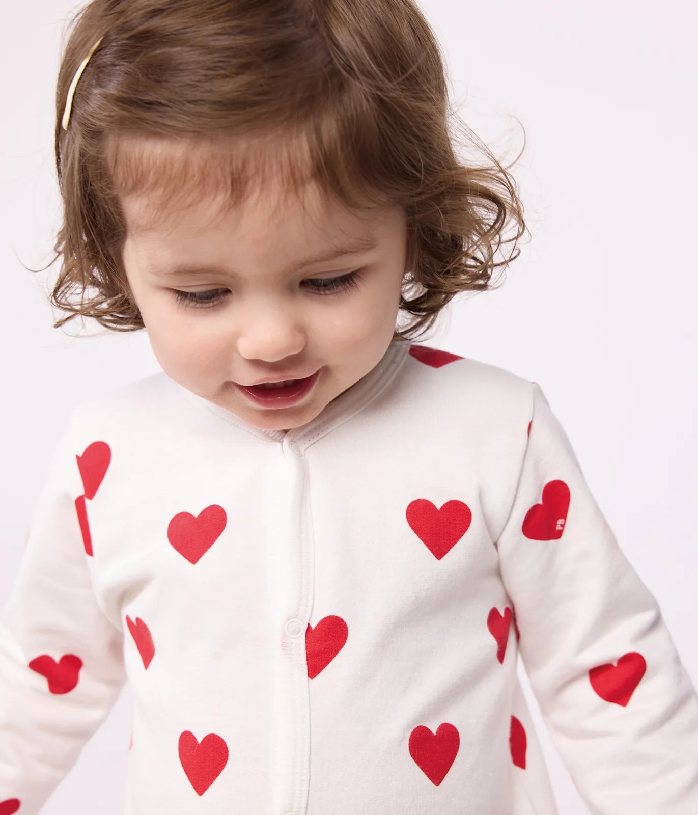 Baby fleece pyjamas with red hearts