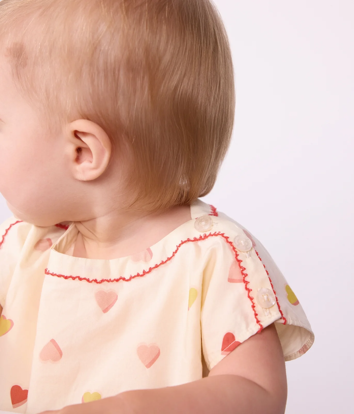 Babies' short-sleeved cotton dress printed with hearts.