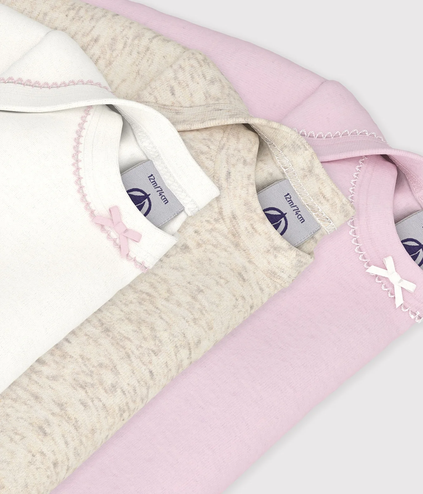 Pack of plain cotton long-sleeved baby bodies